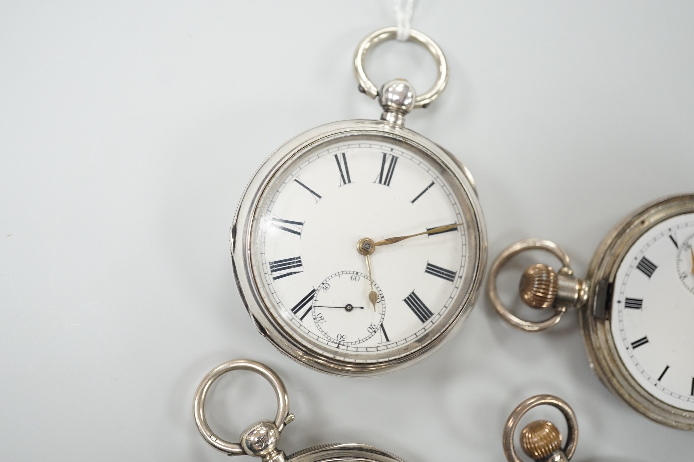 Three assorted Victorian and later silver open face pocket watches, including keywind and keyless and a silver hunter pocket watch.